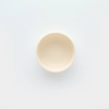 Beige ceramic bowl on a white background