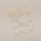 Close-up of a beige liquid substance on a light beige background