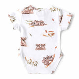 Baby onesie with koala print on a white background