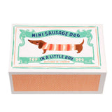 Small box with a design of a mini sausage dog on a white background