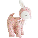 Floral-patterned plush toy on a white background