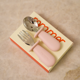 Pink children's fork and spoon set on a beige box with 'Sommor' branding.
