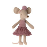 Stuffed mouse toy in a pink dress with a white background