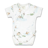 Baby onesie with nature-themed print on a white background