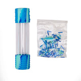 A clear cylindrical tube with metallic blue ribbed caps on both ends, shown next to a clear plastic bag filled with blue and green shredded decorative paper.