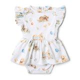 Baby dress with bunny and Easter egg pattern on a white background