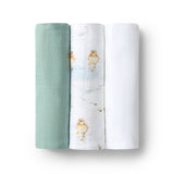 Two swaddle blankets, one green and one with duck design, on a white background