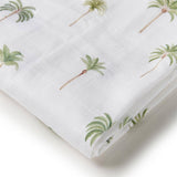 White fabric with green palm tree patterns on a white background