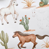 Watercolor-style illustration of desert animals and plants on a white background, including a white horse, a brown horse, cacti, and succulents.