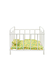 White crib with green floral bedding on a white background