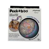 Packaging of a Peekaboo hide and seek sensory bag with unicorn design on a white background