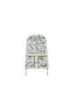 A padded baby support seat or diaper pad cover with a pale blue-gray background and an all-over pattern of small yellow stars, tied with a cream-colored band at the waist, shown on a plain white background.