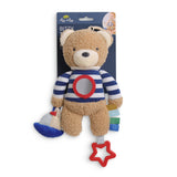 Teddy bear toy with striped sweater and star-shaped pull on a white background