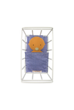 Baby blanket with a face design in a white metal basket on a white background