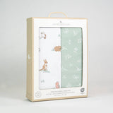 Packaged swaddle wraps with animal patterns on a light gray background