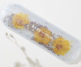 Clear case with yellow flowers and 'BARE MUM' text on a white background