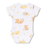 A white short-sleeve baby bodysuit with a cute watercolor-style farm print featuring yellow chicks, orange calves, hay bales, and a small basket, shown flat against a white background.