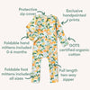 Baby onesie with lemon pattern and features listed on a white background