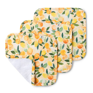 Set of three baby changing pads with lemon pattern on a white background