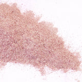 Pink glitter powder on a white background