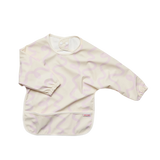 A long-sleeve baby bib in cream with a light pink wavy pattern, featuring elastic cuffs and a front pocket, shown on a plain white background.