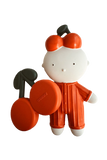 A baby teether toy featuring a white cartoon character wearing an orange outfit and holding two orange cherries with black stems. The brand name 'COOCHU' is embossed on one of the cherries.