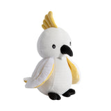 Knitted parrot toy with white body, yellow crest, and black feet on a white background