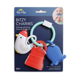 Baby teething ring with colorful charms on its packaging, featuring the brand 'itzy ritzy'.