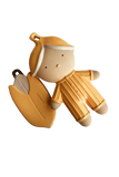 A matte ceramic baby teething toy featuring a stylized doll character in a yellow-orange outfit and a matching banana-shaped accessory, both with a small metal keyring, on a plain white background.