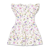 A white sleeveless dress with ruffled cap sleeves and a gathered waist, covered in a colorful watercolor-style floral print with pink, purple, blue, yellow, and green details, shown against a plain white background.