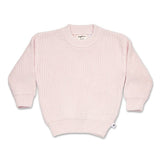 Pink sweater on a white background
