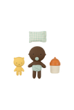 Set of baby toys including a bear, a baby in a diaper, and a bottle on a white background