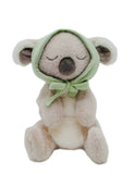 Plush toy koala wearing a green hood on a white background