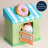 Toy bakery with a donut and ice cream character on a beige background