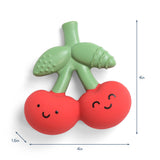 Green and red toy with a happy face design, showing measurements on a white background