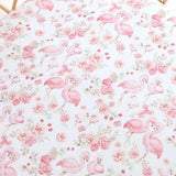 Snuggle Hunny Flamingos Organic Bassinet Sheet and Change Pad Cover featuring a playful flamingo print for newborn baby bedding and nursery styling.