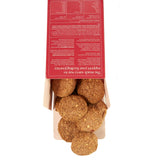 Dog treats in a cardboard packaging with a red label on a white background
