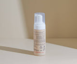 Foam pump bottle on a neutral background