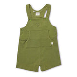 An olive green corduroy baby overall romper with adjustable shoulder straps, green snap buttons, a front bib pocket, and a small embroidered monogram on the chest, shown against a plain white background.