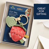 Strawberry-themed baby teether with packaging labeled 'Itzy Pal' on a beige background.