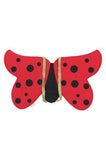Red butterfly-shaped object with black spots on a white background