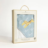 Baby hooded towel with giraffe design in a Living Textiles packaging on a white background