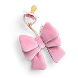 Pink butterfly-shaped teether with a pacifier on a white background