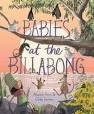 Illustrated book cover for 'Babies at the Billabong' by Maura Finn & Cate James, showing a family of kangaroos, a koala, a bird, a bat, and a woman sitting by a billabong at sunset with large stylized title text across the center.