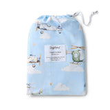 Organic cot sheet with airplane and helicopter design on a blue background