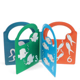 Set of four colorful children's books with fish illustrations and numbers on a white background