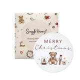 Snuggle Hunny Santa's Toy Shop reversible baby's first Christmas milestone card with vintage Christmas toy illustrations.