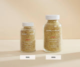 Two jars of Bare Mum size bath salts on a beige background