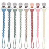 Set of colorful pacifier clips on a white background
