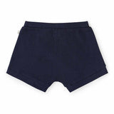 Snuggle Hunny Moonlight organic cotton toddler shorts in deep blue, Size 1, featuring a ribbed fabric and elasticated waistband.